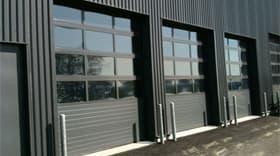 Porte sectionnelle pour concession automobile